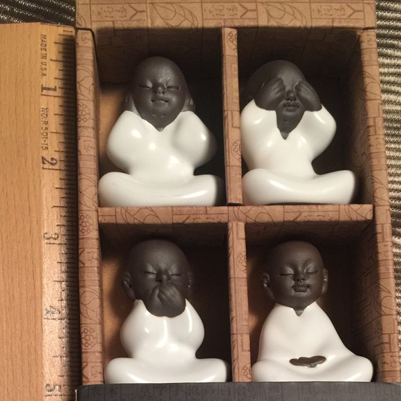 Four Buddha monk ceramic statues