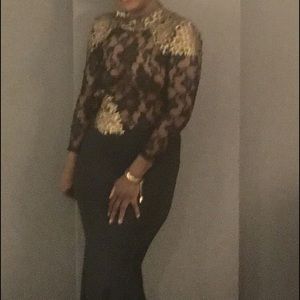 Black and gold gown backless with a train