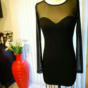 Black Mini. Curve Hugging, Sheer Long Sleeve.