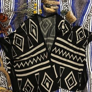 Black and white geometrical poncho
