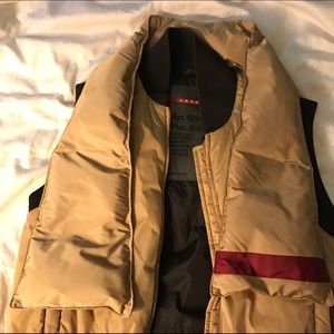 Prada down vest with detachable scarf.