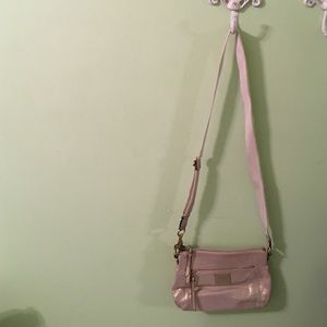 Cream colored Coach purse. Lightly used.