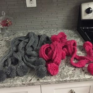 Two long braided scarves.