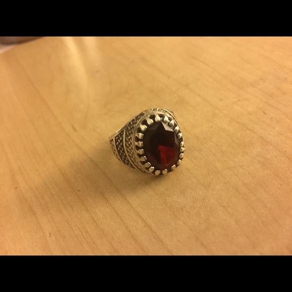 Silver ring with a precious stone
