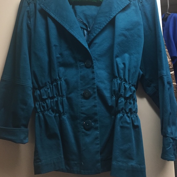 Jacket in Solid Teal color.