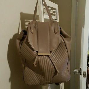 Tan colored backpack. Gently used.