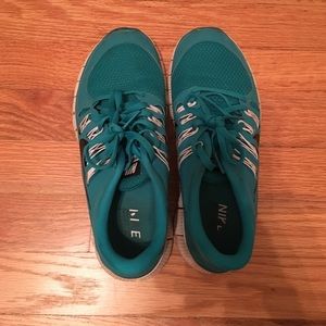 Nike Free 5.0 running shoes.