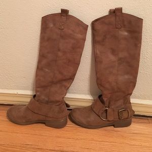 Tall tan riding boots.