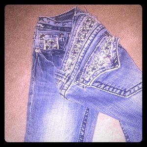Miss Me Jeans size 28 and Rocking Reveal size 28.