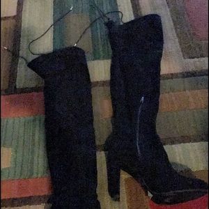 Above the knee black boots