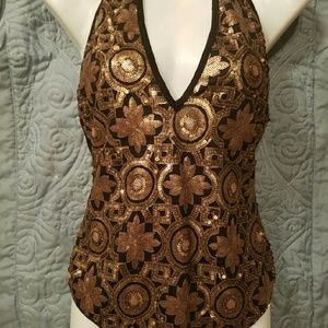 Black and gold sequined body suit