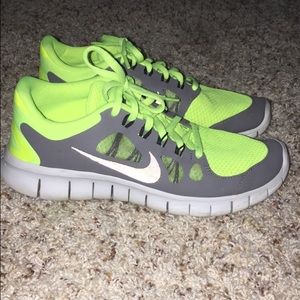 Neon yellow Nike free runs