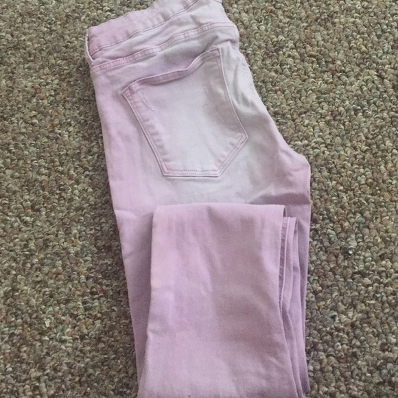 Faded pink slightly distressed skinny jeans