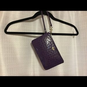 Purple Coach wristlet.