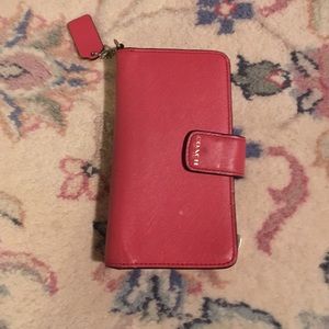 Coach salmon colored clutch