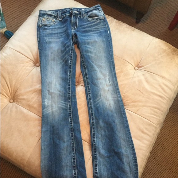 One pair of Miss Me jeans with cow patch