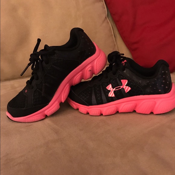 Under armour kids black and pink sneakers.