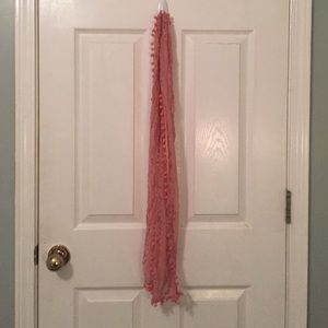 Skinny pink scarf with pom-poms
