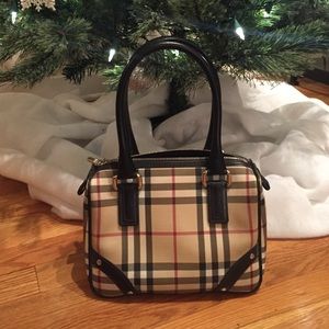 Burberry handbag, trademark plaid.