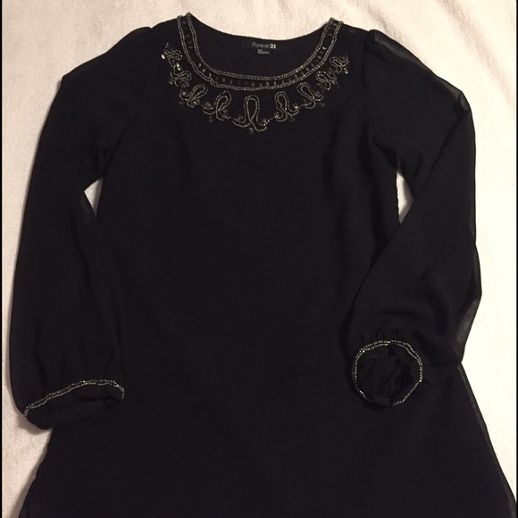 Small black long sleeve dress. - Picture 1 of 2