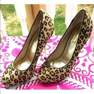 Pony hair leopard print pumps with gold heels.