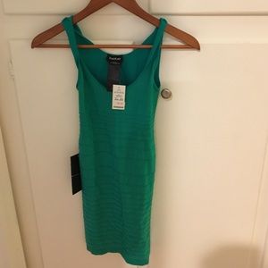 Never been worn green Bebe dress. Size: small.