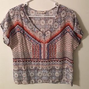 Multi colored top. Short in length but not a crop