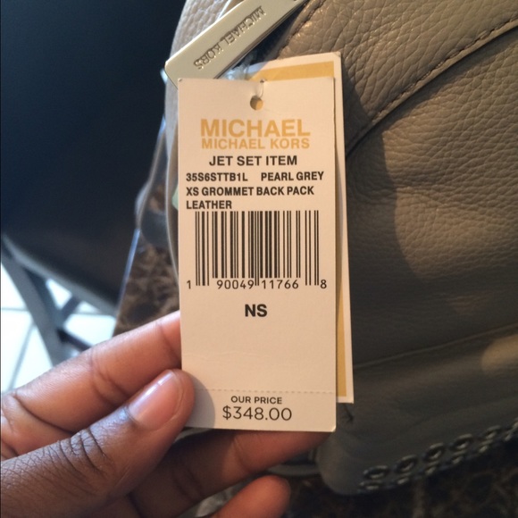 Grey leathered Michaels Kors Backpack