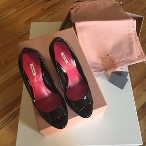 Miu Miu peep toe platform patent leather pumps.