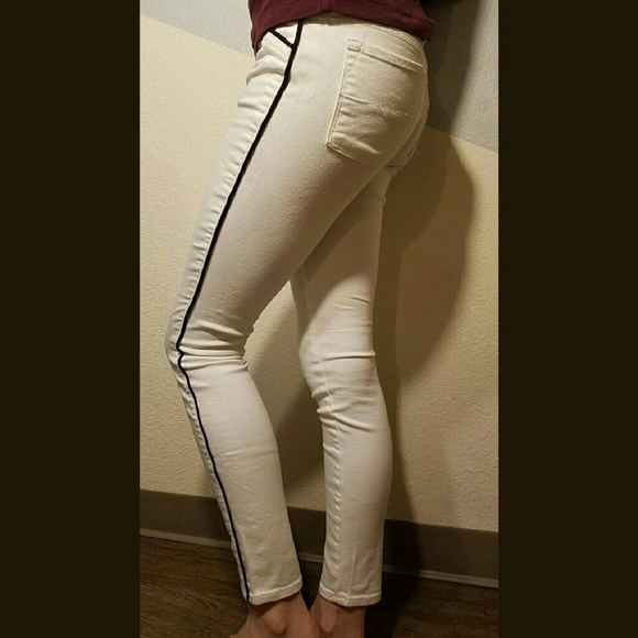 White Jean like pants with black stripe down side