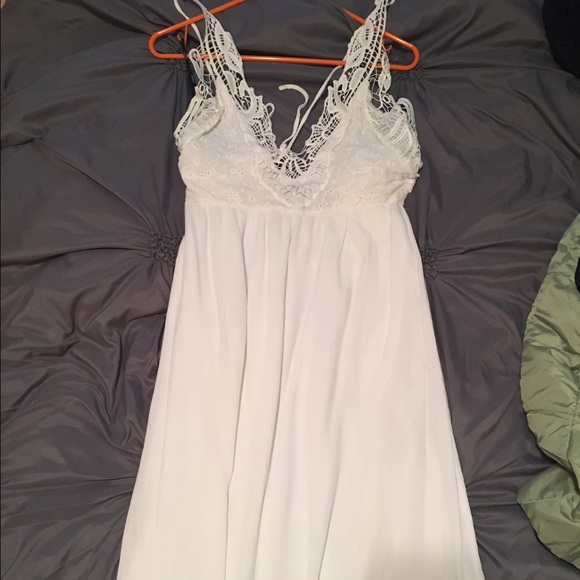 Long white over the neck strap dress
