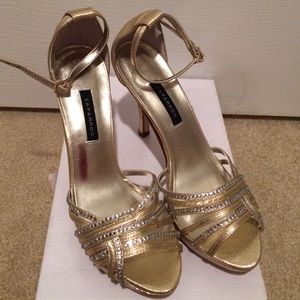 Brand new. Never worn. Gold rhinestones sandals