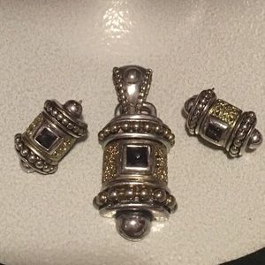 Matching pendant and earrings in stainless steel.