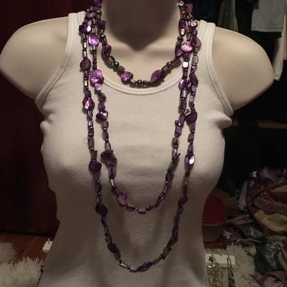 Purple shell and bead layered necklaces.
