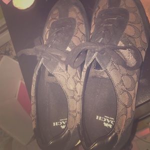 These are Coach shoes/sneakers.