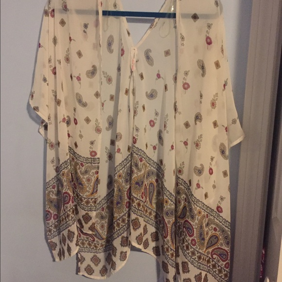 Cream colored flowy shall with flower designs