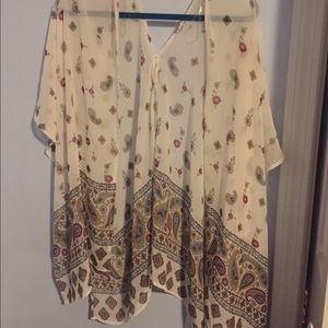 Cream colored flowy shall with flower designs