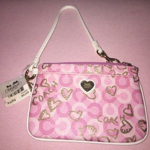 Coach pink, white, and gold wristlet.