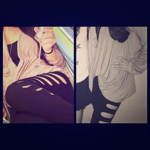 Black ribbed leggings with slits down both sides.