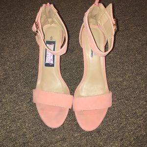 Pink and clear pumps