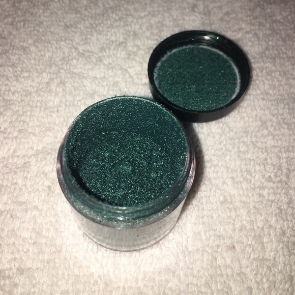 MAC dark teal pigment. More than halfway used.