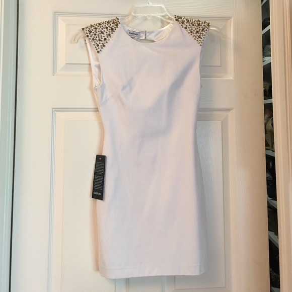 bebe Dresses & Skirts - Bebe White shoulder spike dress.