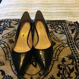 Black pumps, alligator print.