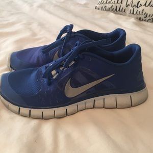 Blue Nike tennis shoes