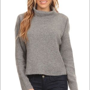 Grey turtleneck sweater with back slit