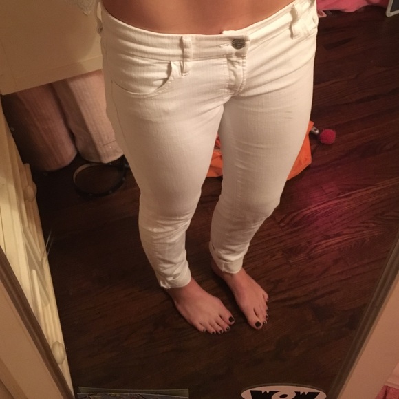 white boot-cut Guess jeans