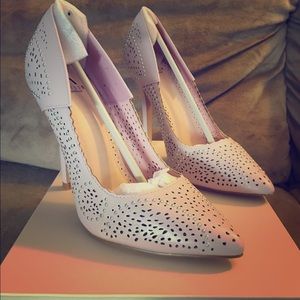 Lace cut leather heels.