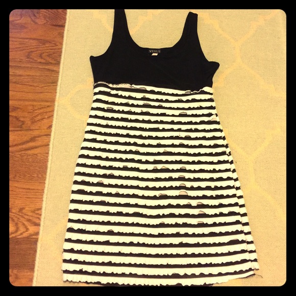 Sleeveless mini ruffle dress.