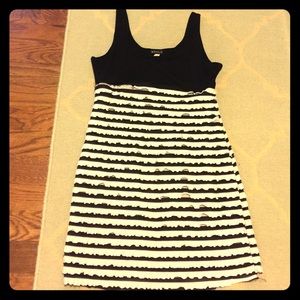 Sleeveless mini ruffle dress.
