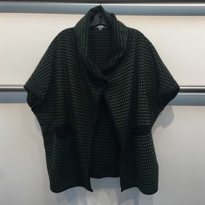 An oversized green cape!